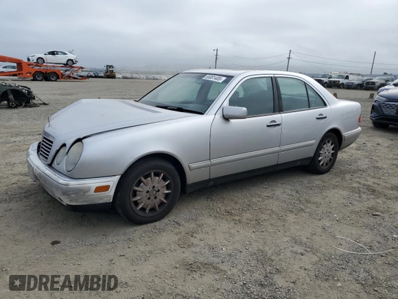 1999 Mercedes-Benz E-Class with VIN WDBJF65H0XA797390, listed as a Copart auction lot 55081405 with 80,950 mi miles and Salvage Title. Bid and sale history available at carsss.com. Image 1.
