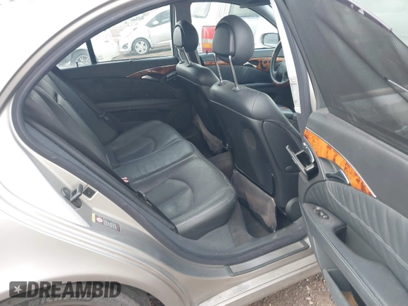 2004 Mercedes-Benz E-Class 5.0L with VIN WDBUF70J14A522118, listed as a IAAI auction lot 41786440 with 153,325 mi miles. Bid and sale history available at carsss.com. Image 8.