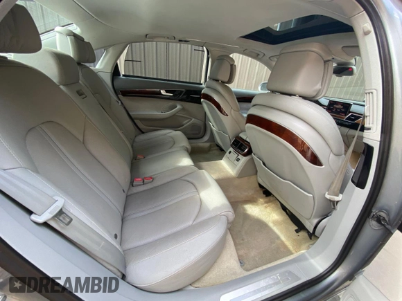 2011 Audi A8 with VIN WAURVAFD7BN018734, listed as a Copart auction lot 63735055 with 79,694 mi miles and Clean title. Bid and sale history available at DreamBid. Image 6.