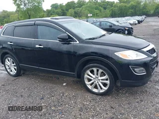 2012 Mazda CX-9 Grand Touring z VIN JM3TB3DV1C0360212, wystawiony jako IAAI lot #42232584 z przebiegiem 99 582 mil mil oraz . Historia ofert i sprzedaży dostępna na DreamBid. Obrazek 1.
