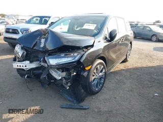 2025 Honda Odyssey Touring with VIN 5FNRL6H81SB011122, listed as a IAAI auction lot 41402170 with 2,968 mi miles and . Bid and sale history available at DreamBid. Image 18.