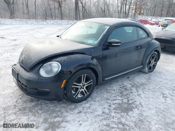 2012 Volkswagen Beetle 2.5L PZEV with VIN 3VWJP7AT8CM619137, listed as a IAAI auction lot 41195954 with 157,741 mi miles. Bid and sale history available at carsss.com. Image 2.
