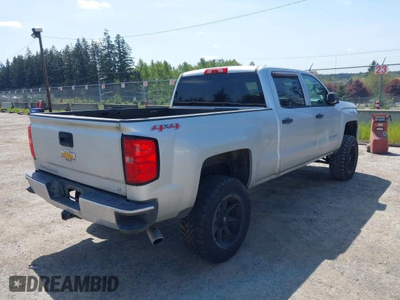 2014 Chevrolet Silverado 1500 LT with VIN 3GCUKREH0EG399090, listed as a IAAI auction lot 42142324 with 104,226 mi miles and . Bid and sale history available at DreamBid. Image 4.