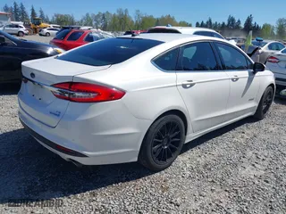 2018 Ford Fusion Hybrid SE with VIN 3FA6P0LU3JR226934, listed as a IAAI auction lot 42063065 with 126,683 mi miles. Bid and sale history available at carsss.com. Image 4.