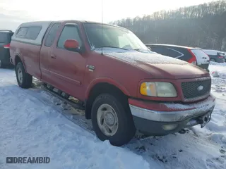 2000 Ford F-150 XL with VIN 1FTRX18WXYNC06121, listed as a IAAI auction lot 41340585 with 74,957 mi miles. Bid and sale history available at carsss.com. Image 1.