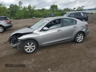 2011 Mazda 3 i Touring with VIN JM1BL1VF3B1491700, listed as a Copart auction lot 61573885 with 145,626 mi miles and Salvage title. Bid and sale history available at DreamBid. Image 1.
