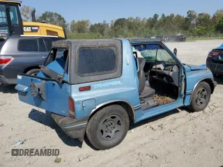 1995 Geo Tracker z VIN 2CNBE18UXS6930601, wystawiony jako Copart lot #76079094 z przebiegiem 276 136 mil mil oraz Szkody całkowita. Historia ofert i sprzedaży dostępna na DreamBid. Obrazek 3.