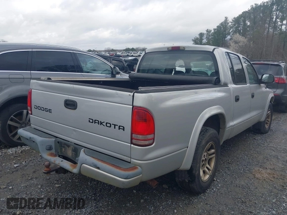 2003 Dodge Dakota z VIN 1D7HL38Z83S184469, wystawiony jako IAAI lot #41714931 z przebiegiem 194 373 mil mil oraz . Historia ofert i sprzedaży dostępna na DreamBid. Obrazek 4.