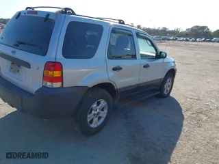 2006 Ford Escape XLT with VIN 1FMCU03166KB47650, listed as a IAAI auction lot 41529751 with 153,962 mi miles. Bid and sale history available at carsss.com. Image 4.