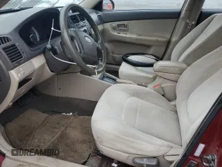 2007 Kia Spectra EX with VIN KNAFE121X75381938, listed as a Copart auction lot 74341004 with 118,890 mi miles and Salvage Title. Bid and sale history available at carsss.com. Image 7.