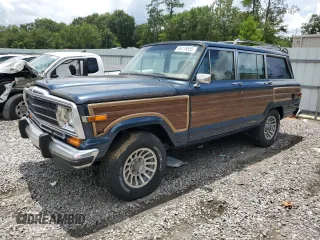 1989 Jeep Grand Wagoneer z VIN 1J4GS5871KP102323, wystawiony jako Copart lot #66118055 z przebiegiem 151 571 mil mil oraz Czysty tytuł • Clean title. Historia ofert i sprzedaży dostępna na DreamBid. Obrazek 1.