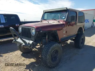 2001 Jeep Wrangler Sahara with VIN 1J4FA59S71P326941, listed as a IAAI auction lot 41648420 with 128,464 mi miles. Bid and sale history available at carsss.com. Image 2.