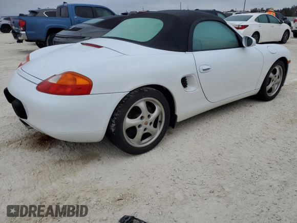 1998 Porsche Boxster с VIN WP0CA2987WU623387, выставлен на аукционе Copart как лот 76859594 с пробегом Не указан миль и Списание • Salvage title. История ставок и продаж доступна на DreamBid. Изображение 3.