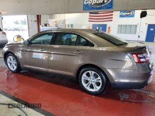 2015 Ford Taurus SEL with VIN 1FAHP2E94FG157022, listed as a Copart auction lot 74569614 with 133,223 mi miles and Salvage Title. Bid and sale history available at DreamBid. Image 2.