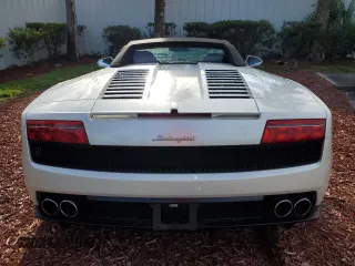 2012 Lamborghini Gallardo z VIN ZHWGU6BZ7CLA11933, wystawiony jako Copart lot #74679154 z przebiegiem Nie podano mil oraz Szkody całkowita. Historia ofert i sprzedaży dostępna na DreamBid. Obrazek 6.