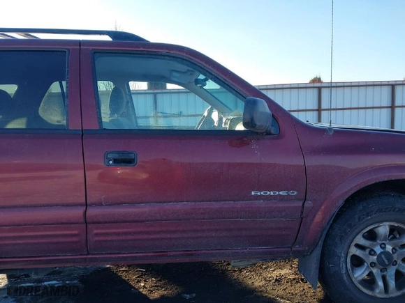2002 Isuzu Rodeo with VIN 4S2DM58W124319936, listed as a IAAI auction lot 41555285 with 143,035 mi miles. Bid and sale history available at carsss.com. Image 13.