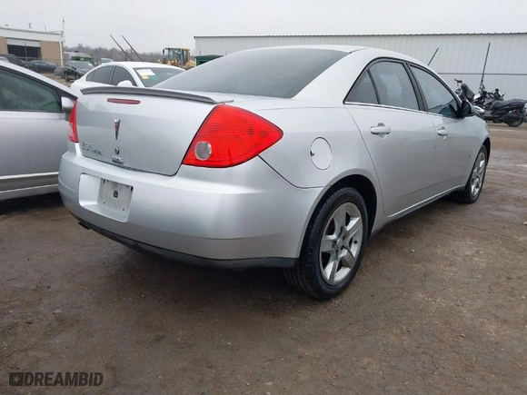 2009 Pontiac G6 w/1SA *Ltd Avail* with VIN 1G2ZG57B994123359, listed as a IAAI auction lot 41492389 with 128489 miles. Bid and sale history available at carsss.com. Image 4.