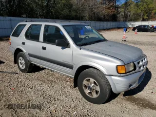 1999 Isuzu Rodeo S with VIN 4S2CK58W7X4357910, listed as a Copart auction lot 86955254 with 105,593 mi miles and Salvage Title. Bid and sale history available at DreamBid. Image 4.