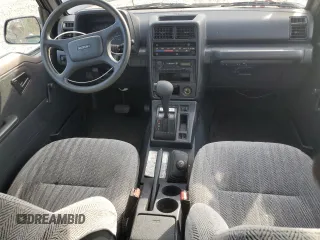 1995 Suzuki Sidekick JX z VIN 2S3TD03V2S6408939, wystawiony jako Copart lot #78862794 z przebiegiem 88 216 mil mil oraz Tytuł czysty. Historia ofert i sprzedaży dostępna na DreamBid. Obrazek 8.