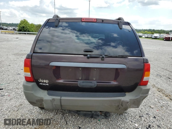 2004 Jeep Grand Cherokee Laredo with VIN 1J4GW48S64C121057, listed as a Copart auction lot 67765474 with 166,359 mi miles and Salvage title. Bid and sale history available at DreamBid. Image 6.