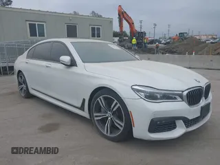 2019 BMW 7 Series 750i with VIN WBA7F0C5XKGM25771, listed as a IAAI auction lot 42167614 with 73,692 mi miles. Bid and sale history available at carsss.com. Image 1.