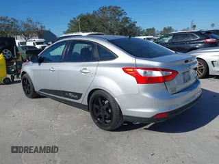 2012 Ford Focus SE with VIN 1FAHP3F23CL265724, listed as a IAAI auction lot 41184121 with 216,873 mi miles. Bid and sale history available at carsss.com. Image 3.