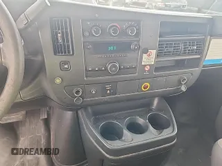 2013 Chevrolet Express Cargo with VIN 1GCWGFCA4D1142736, listed as a IAAI auction lot 42854305 with 128,585 mi miles and . Bid and sale history available at DreamBid. Image 3.