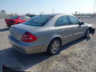2003 Mercedes-Benz E-Class 3.2L with VIN WDBUF65J93X099223, listed as a IAAI auction lot 42033473 with 230,758 mi miles. Bid and sale history available at carsss.com. Image 4.