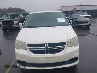 2012 Dodge Grand Caravan SXT with VIN 2C4RDGCG4CR304472, listed as a IAAI auction lot 41396437 with 180,309 mi miles and . Bid and sale history available at DreamBid. Image 12.