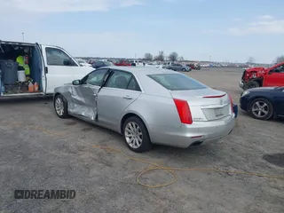 2014 Cadillac CTS Luxury AWD z VIN 1G6AX5SX2E0196881, wystawiony jako IAAI lot #41707633 z przebiegiem 169 168 mil mil oraz . Historia ofert i sprzedaży dostępna na DreamBid. Obrazek 3.