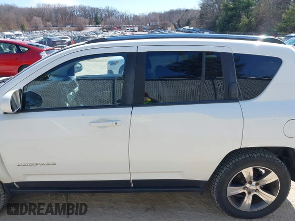 2016 Jeep Compass High Altitude with VIN 1C4NJDEB4GD767731, listed as a IAAI auction lot 41977400 with 99,890 mi miles and . Bid and sale history available at DreamBid. Image 14.