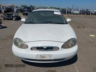 1996 Mercury Sable z VIN 1MELM55U0TG623025, wystawiony jako IAAI lot #42320328 z przebiegiem 235 325 mil mil oraz . Historia ofert i sprzedaży dostępna na DreamBid. Obrazek 6.