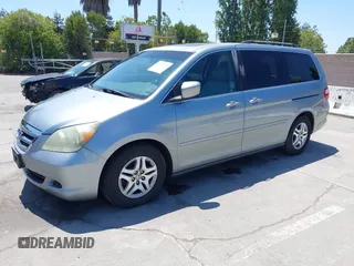 2006 Honda Odyssey EX-L z VIN 5FNRL38716B051664, wystawiony jako IAAI lot #42520320 z przebiegiem 304 835 mil mil oraz . Historia ofert i sprzedaży dostępna na DreamBid. Obrazek 2.
