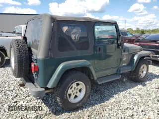2001 Jeep Wrangler Sahara with VIN 1J4FA59S61P373670, listed as a Copart auction lot 74060614 with 176,111 mi miles and Clean Title. Bid and sale history available at carsss.com. Image 3.