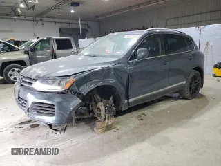 2011 Volkswagen Touareg Sport with VIN WVGFF9BP2BD005215, listed as a Copart auction lot 85972164 with 144,048 mi miles and Salvage Title. Bid and sale history available at DreamBid. Image 1.