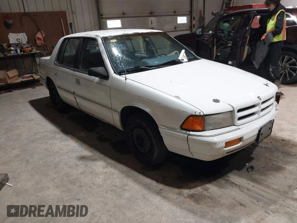 1994 Dodge Spirit z VIN 3B3AA46KXRT214299, wystawiony jako IAAI lot #41908262 z przebiegiem 72 619 mil mil oraz . Historia ofert i sprzedaży dostępna na DreamBid. Obrazek 1.