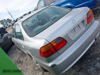 1999 Honda Civic EX with VIN 2HGEJ8649XH590637, listed as a IAAI auction lot 41584579 with 184,999 mi miles. Bid and sale history available at carsss.com. Image 3.