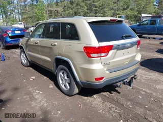 2011 Jeep Grand Cherokee Laredo with VIN 1J4RR4GG8BC590094, listed as a IAAI auction lot 41990149 with 178,510 mi miles. Bid and sale history available at carsss.com. Image 3.