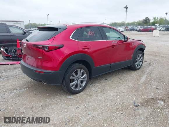 2023 Mazda CX-30 S Premium with VIN 3MVDMBDM3PM511402, listed as a IAAI auction lot 42180001 with 6,189 mi miles and . Bid and sale history available at DreamBid. Image 4.