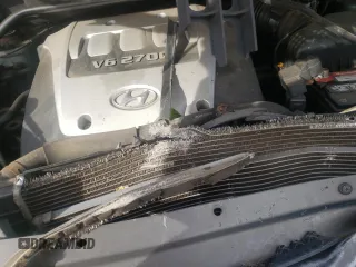 2005 Hyundai Tucson GLS with VIN KM8JN72D75U080052, listed as a Copart auction lot 75173014 with 106,479 mi miles and Salvage Title. Bid and sale history available at carsss.com. Image 12.