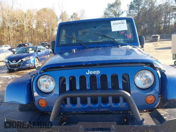 2009 Jeep Wrangler Sahara z VIN 1J4FA54199L722192, wystawiony jako IAAI lot #41619305 z przebiegiem 105 545 mil mil oraz . Historia ofert i sprzedaży dostępna na DreamBid. Obrazek 17.
