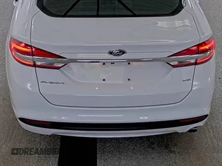 2018 Ford Fusion SE z VIN 3FA6P0H79JR171487, wystawiony jako IAAI lot #42418974 z przebiegiem 55 846 mil mil oraz . Historia ofert i sprzedaży dostępna na DreamBid. Obrazek 1.