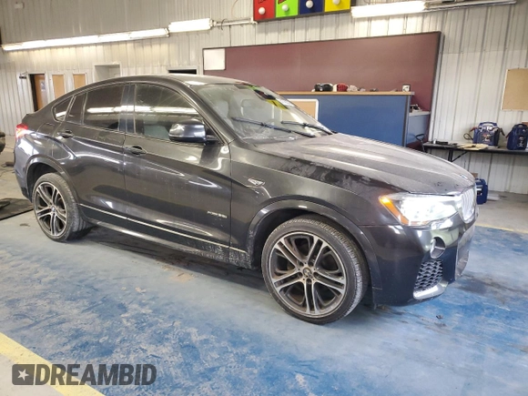 2015 BMW X4 xDrive35i with VIN 5UXXW5C51F0E88340, listed as a Copart auction lot 41765245 with 140,510 mi miles and Clean title. Bid and sale history available at DreamBid. Image 4.