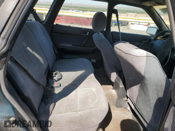 1994 Subaru Legacy L with VIN 4S3BJ6337R7955431, listed as a Copart auction lot 70200794 with 281,694 mi miles and Salvage Title. Bid and sale history available at DreamBid. Image 10.