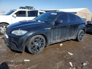 2014 BMW X6 M with VIN 5YMGZ0C50E0C40694, listed as a Copart auction lot 43943305 with 124,104 mi miles and Salvage Title. Bid and sale history available at carsss.com. Image 1.