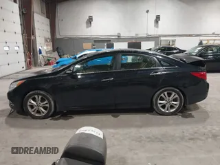 2012 Hyundai Sonata SE z VIN 5NPEC4AC9CH355351, wystawiony jako IAAI lot #42318588 z przebiegiem 122 864 mil mil oraz . Historia ofert i sprzedaży dostępna na DreamBid. Obrazek 14.