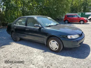 1999 Toyota Corolla VE with VIN 1NXBR12E7XZ240321, listed as a Copart auction lot 64259115 with 144,145 mi miles and Salvage title. Bid and sale history available at DreamBid. Image 4.