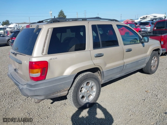 2001 Jeep Grand Cherokee Laredo with VIN 1J4GW48S11C519210, listed as a IAAI auction lot 42093631 with 211,024 mi miles. Bid and sale history available at carsss.com. Image 4.