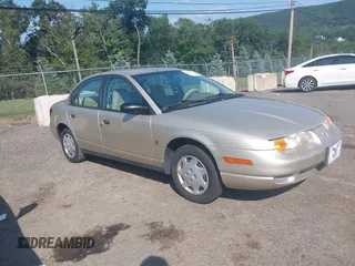 2002 Saturn SL z VIN 1G8ZH52812Z227514, wystawiony jako IAAI lot #42859934 z przebiegiem 84 221 mil mil oraz . Historia ofert i sprzedaży dostępna na DreamBid. Obrazek 1.