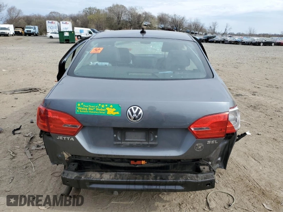 2014 Volkswagen Jetta SEL z VIN 3VWL17AJ9EM441590, wystawiony jako Copart lot #50995785 z przebiegiem Nie podano mil oraz Szkoda całkowita • Salvage title. Historia ofert i sprzedaży dostępna na DreamBid. Obrazek 6.